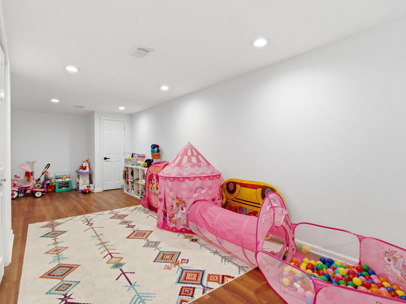 Cluttered playroom before object removal